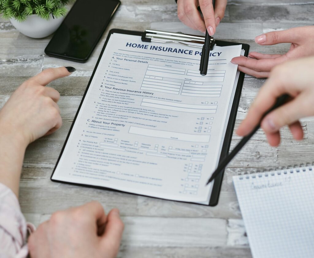 homeowner reviewing homeowners insurance policy with insurance agent
